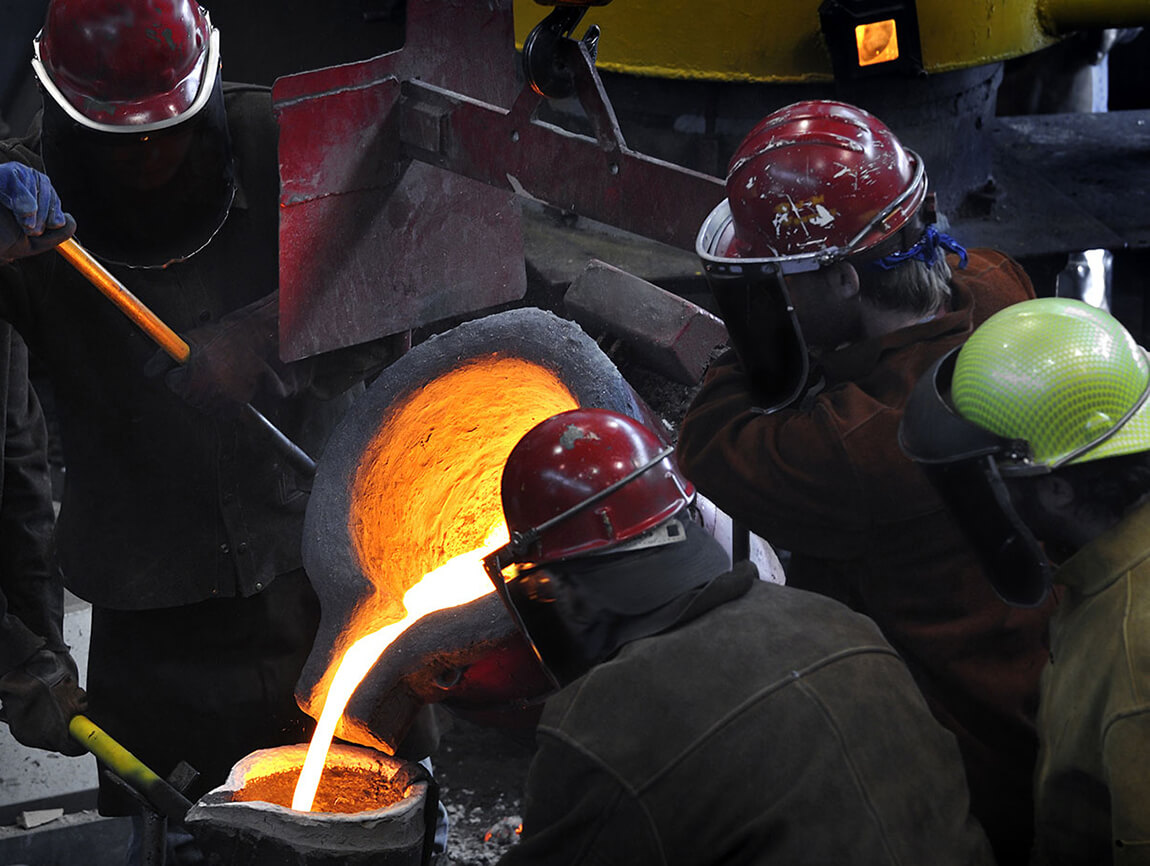 Foundry Workers Pouring Molten Steel